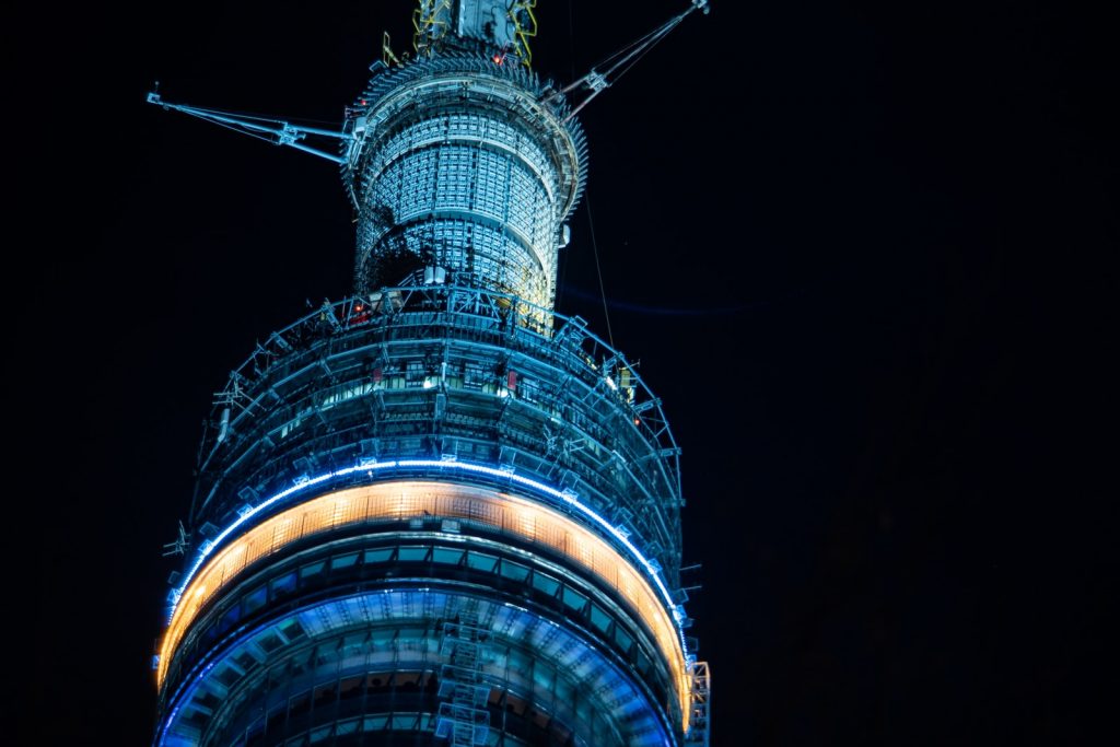 blue and black tower during night time